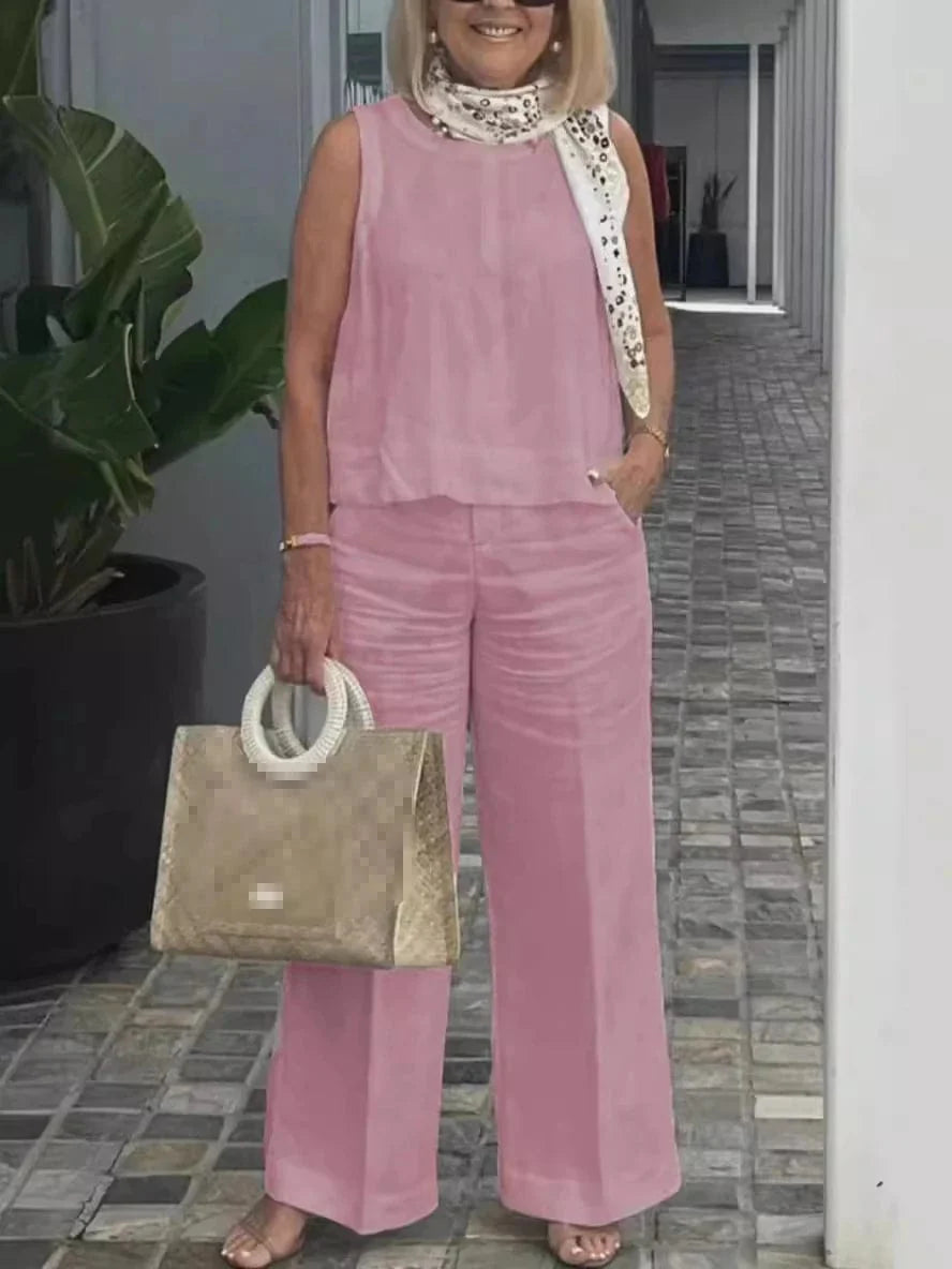 Women's cotton linen two-piece set by Showlu Fashion with sleeveless loose blouse and wide-leg pants, perfect for casual summer wear.