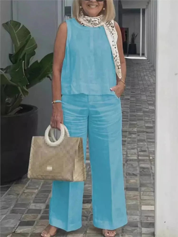Women's cotton linen two-piece set with sleeveless loose blouse and wide-leg pants, stylish summer casual outfit by Showlu Fashion.