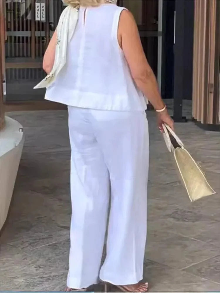 Women's cotton linen two-piece set with sleeveless blouse and wide-leg pants, casual summer outfit by Showlu Fashion Store.