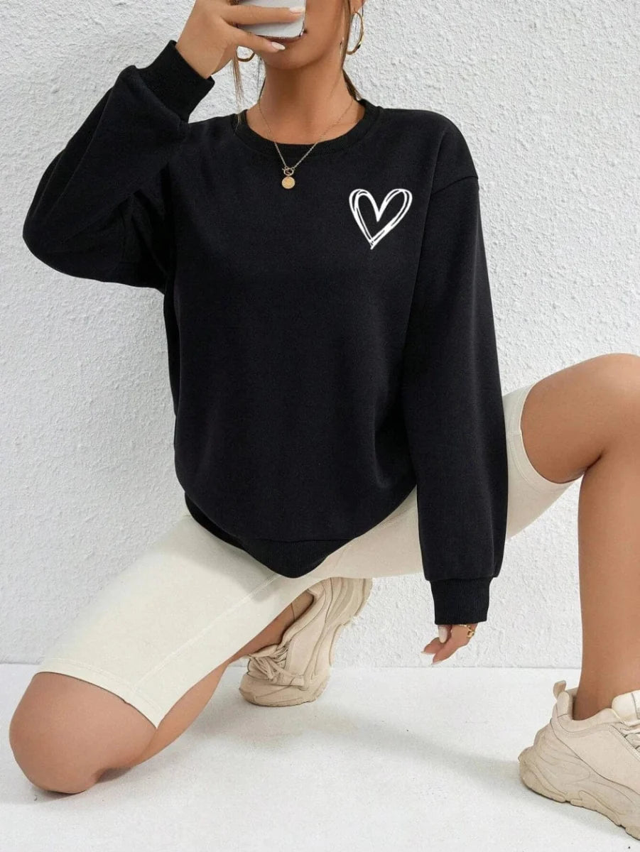 Showlu Fashion Women's Heart Print Fleece Sweatshirt with casual crewneck, featuring a simple heart pattern, warm and comfortable.
