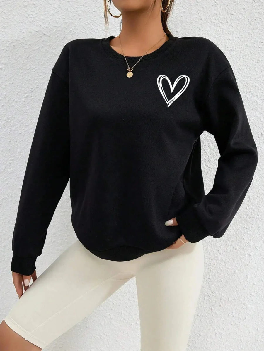 Women's heart print fleece sweatshirt by Showlu Fashion, featuring a casual crewneck design with a cozy, loose fit and comfortable fleece fabric.
