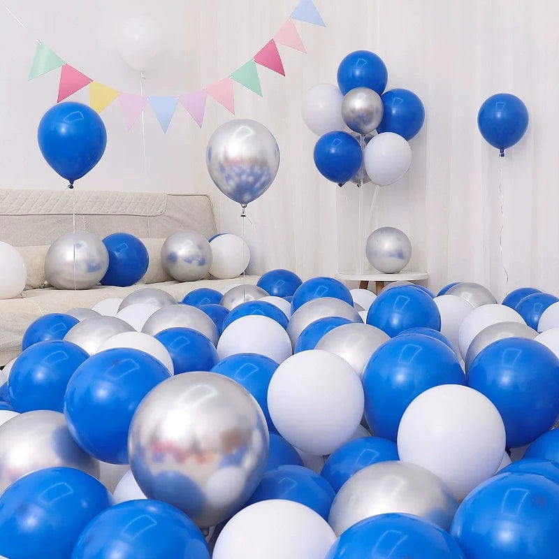 Six blue and white macaron-shaped balloons in a birthday and graduation decoration setup.