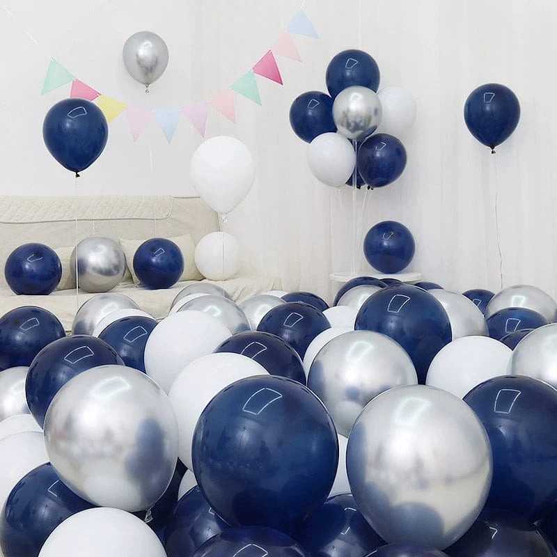 Six blue and white macaron-shaped balloons in a birthday or celebration decoration setup.