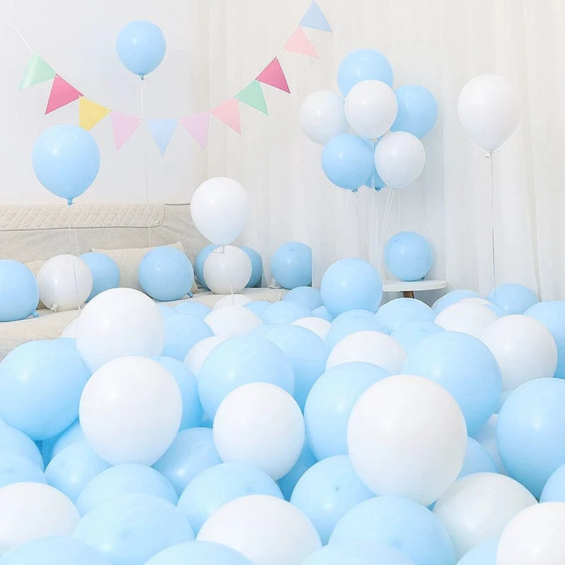Set of six blue and white macaron-shaped balloons for birthday or graduation decorations, arranged in a festive scene.
