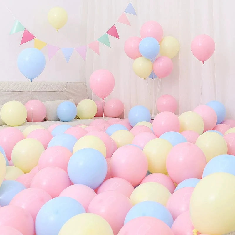 Six blue and white macaron-shaped balloons in a birthday and graduation decoration scene, perfect for celebrations.