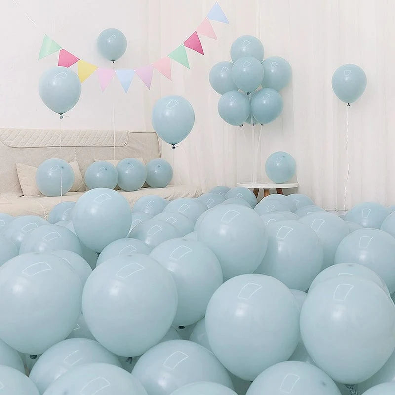 Six blue and white macaron-shaped balloons in a birthday and graduation decoration set, perfect for celebration scenes.