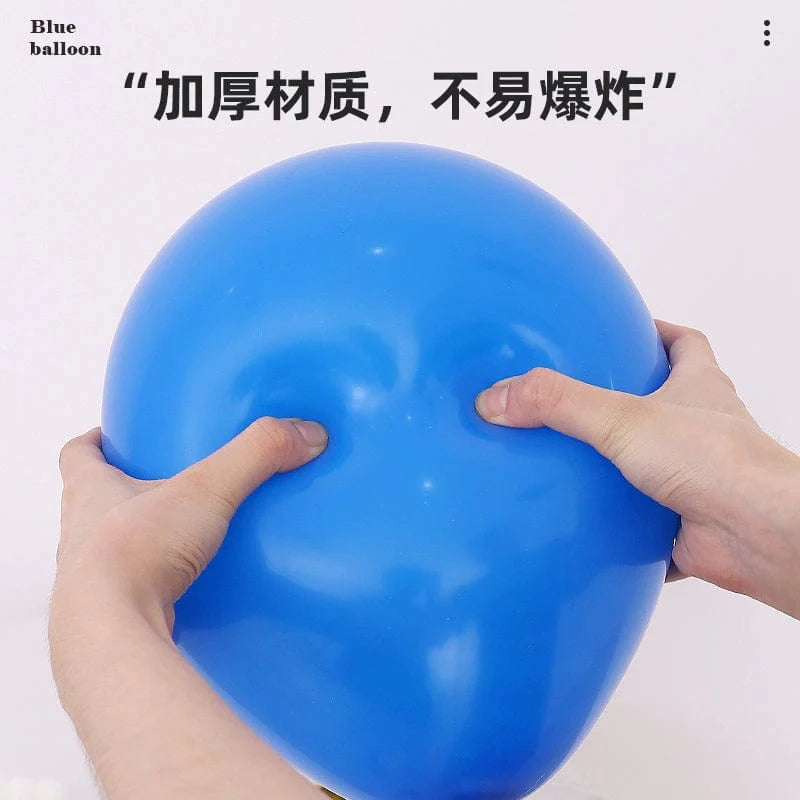 Six blue and white macaron-shaped balloons in a birthday and graduation scene decoration setup.