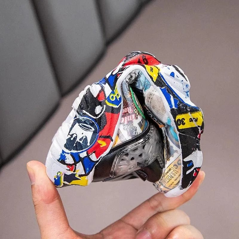 Kids' Showlu cartoon graffiti sports sneakers for boys and girls, featuring colorful casual and basketball shoe design
