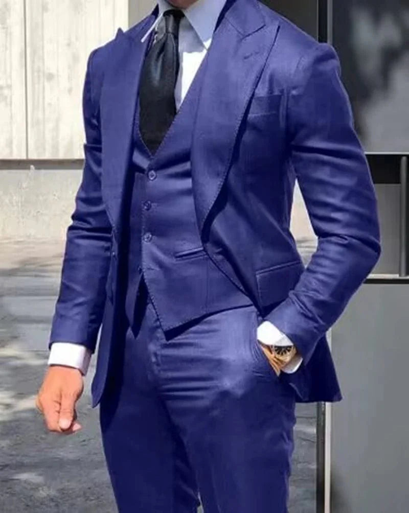 Men's 3-piece slim fit wedding suit with peak lapel tuxedo by Showlu Fashion, includes blazer, vest, and pants in solid color.
