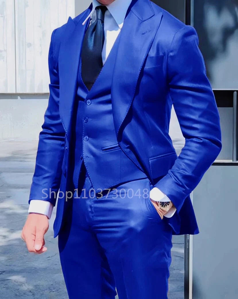 Men's 3-piece slim fit wedding suit by Showlu Fashion with peak lapel tuxedo, blazer, vest, and dress pants in a solid color.