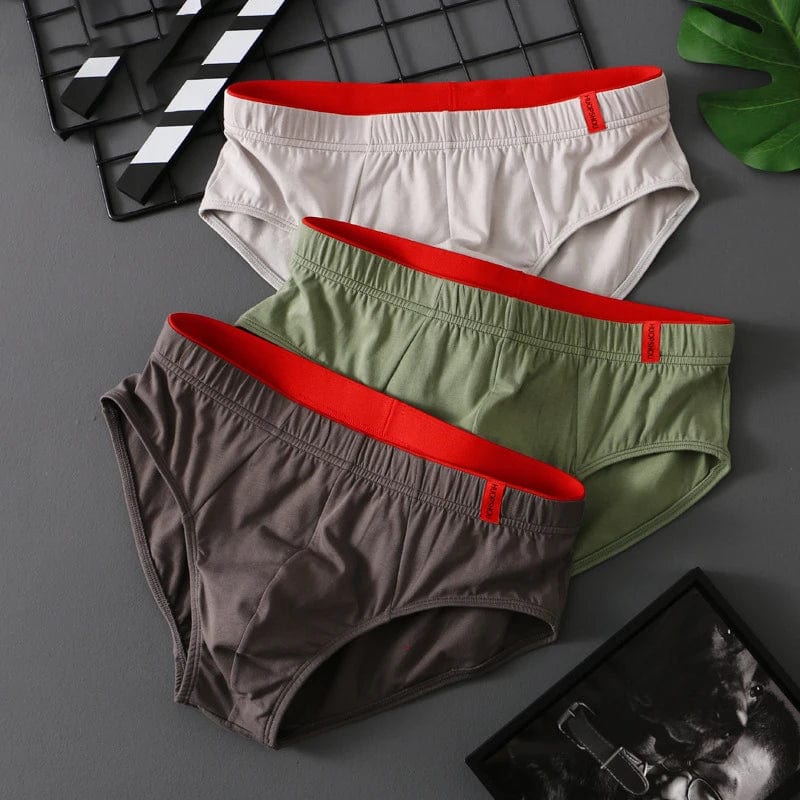 Showlu men's cotton convex pouch briefs, low-rise breathable underwear in solid color, designed for comfort and support.