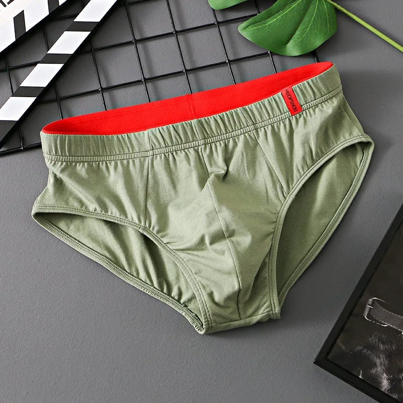 Showlu men's cotton convex pouch briefs, low-rise breathable underwear in solid color, designed for comfort and support.