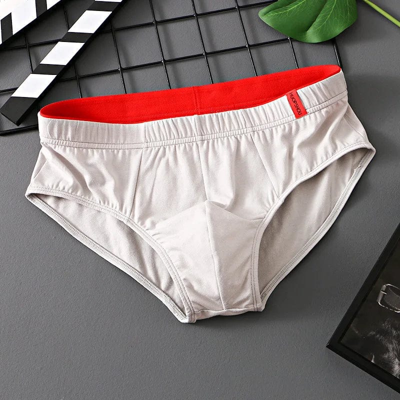 Showlu men's cotton convex pouch briefs in solid color, low-rise breathable underwear designed for comfort and support.