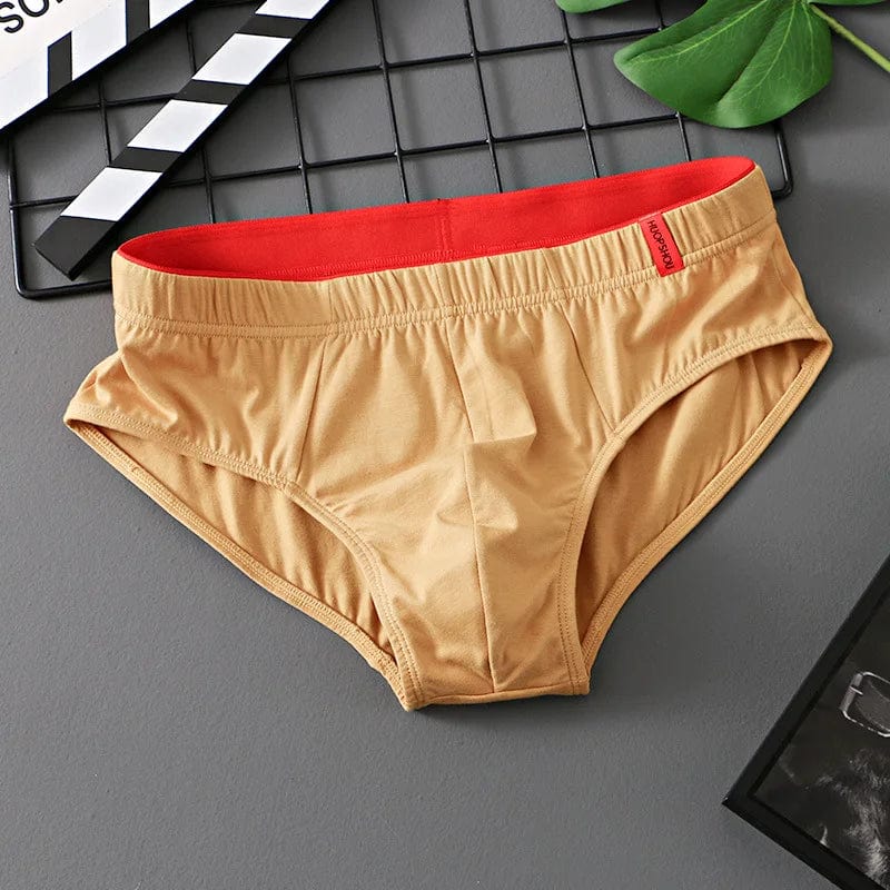 Showlu men's cotton convex pouch briefs with low-rise design, breathable fabric, solid color, and comfortable fit for everyday wear.