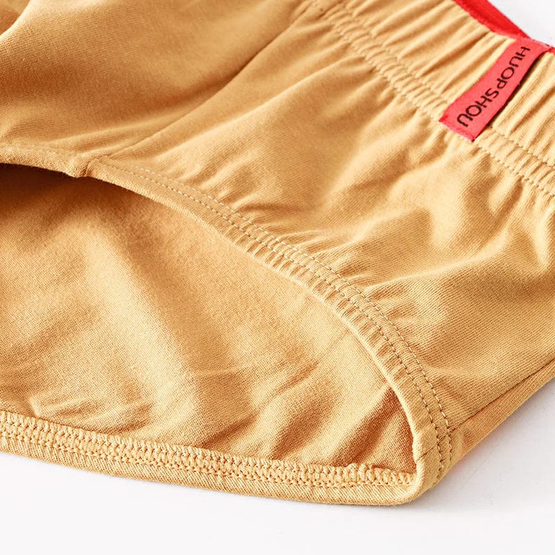 Showlu men's cotton convex pouch briefs in solid color, low-rise breathable underwear designed for comfort and support.