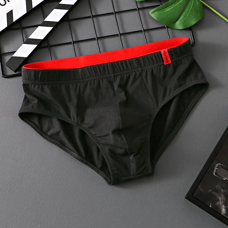 Showlu men's cotton convex pouch briefs in solid color, low-rise breathable underwear designed for comfort and support.