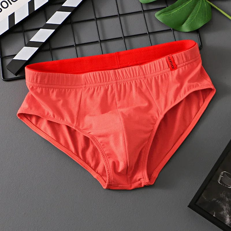 Showlu Men's cotton convex pouch briefs in solid color, low-rise breathable underwear designed for comfort and support.