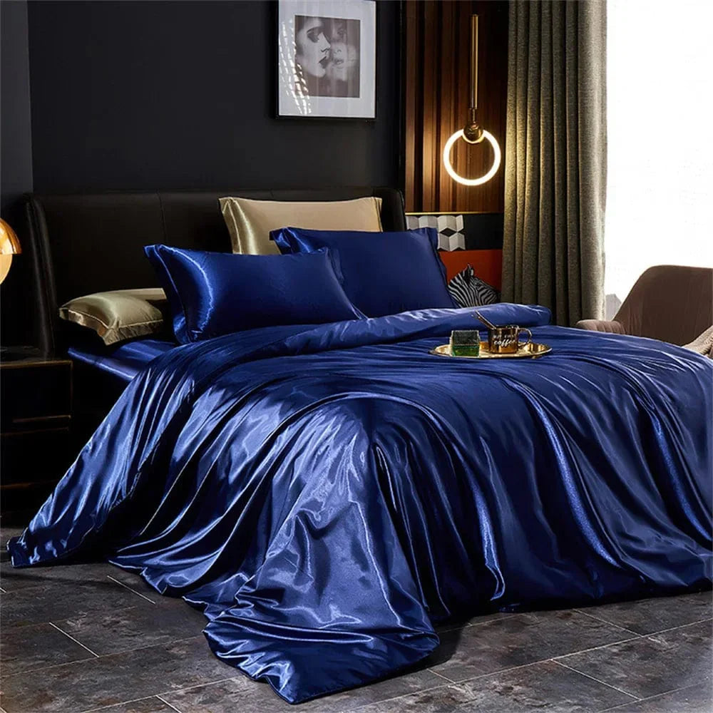 Luxury silk satin bedding set with duvet cover, pillowcases, and bedsheet in elegant solid design for king, queen, or twin beds.