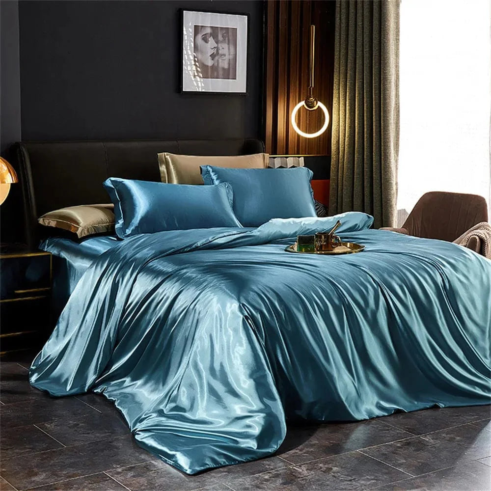 Luxury silk satin bedding set with duvet cover, pillowcases, and bed sheet in elegant solid design for king, queen, or twin beds.