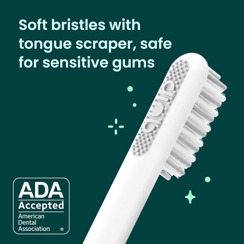 Quip Sonic Electric Toothbrush for Adults with soft bristles, plastic handle, travel cover, and replaceable brush head in magenta color.