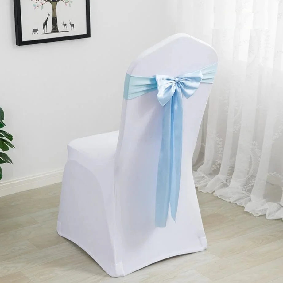 Spandex chair sash with bow tie for weddings and events, showing stretch Lycra fabric in a festive hotel or party setting.