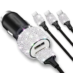 A dual USB car charger decorated with sparkling rhinestones and three attached charging cables.