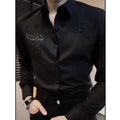 Black men's slim fit rhinestone button-up shirt by Showlu Fashion, long sleeve, casual yet stylish for spring and autumn.
