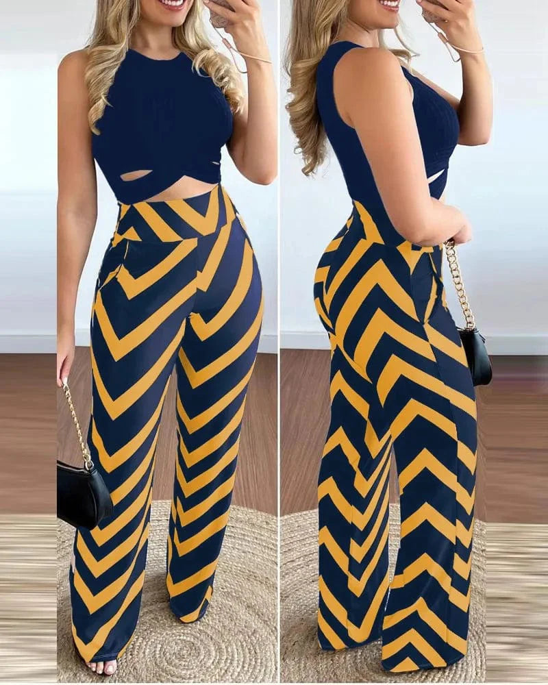 Owner Girl Women's 2-piece set featuring a printed sleeveless top and slim trousers, perfect for spring-summer casual or office wear.