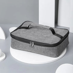 A gray rectangular insulated lunch bag with a top handle and a double zipper closure.