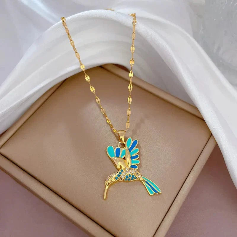 Blue hummingbird pendant necklace in stainless steel, featuring a delicate bird design on a chain, perfect for women and girls.
