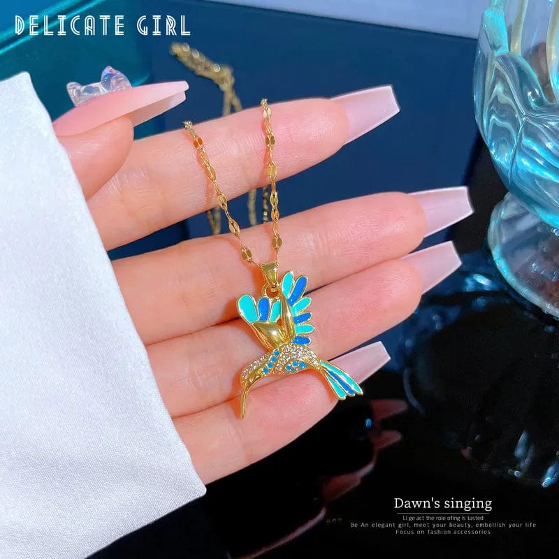 Blue hummingbird pendant necklace in stainless steel, featuring a delicate animal jewelry design for women and girls.