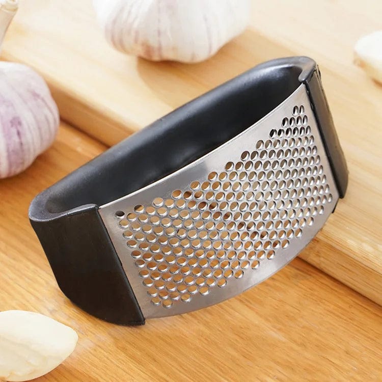 Showlu Fashion Store JIUAN stainless steel garlic press and manual mincer for chopping garlic and vegetables in the kitchen.