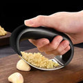 Showlu Fashion Store JIUAN stainless steel garlic press and mincer, manual kitchen crusher for garlic, fruit, and vegetable preparation.