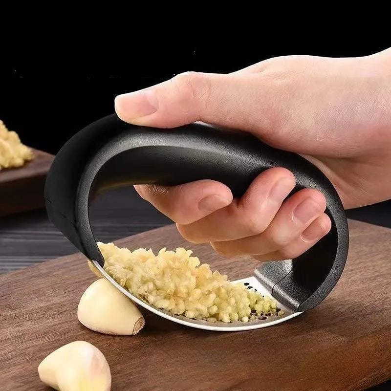Showlu Fashion Store JIUAN stainless steel garlic press and mincer, manual kitchen crusher for garlic, fruit, and vegetable preparation.
