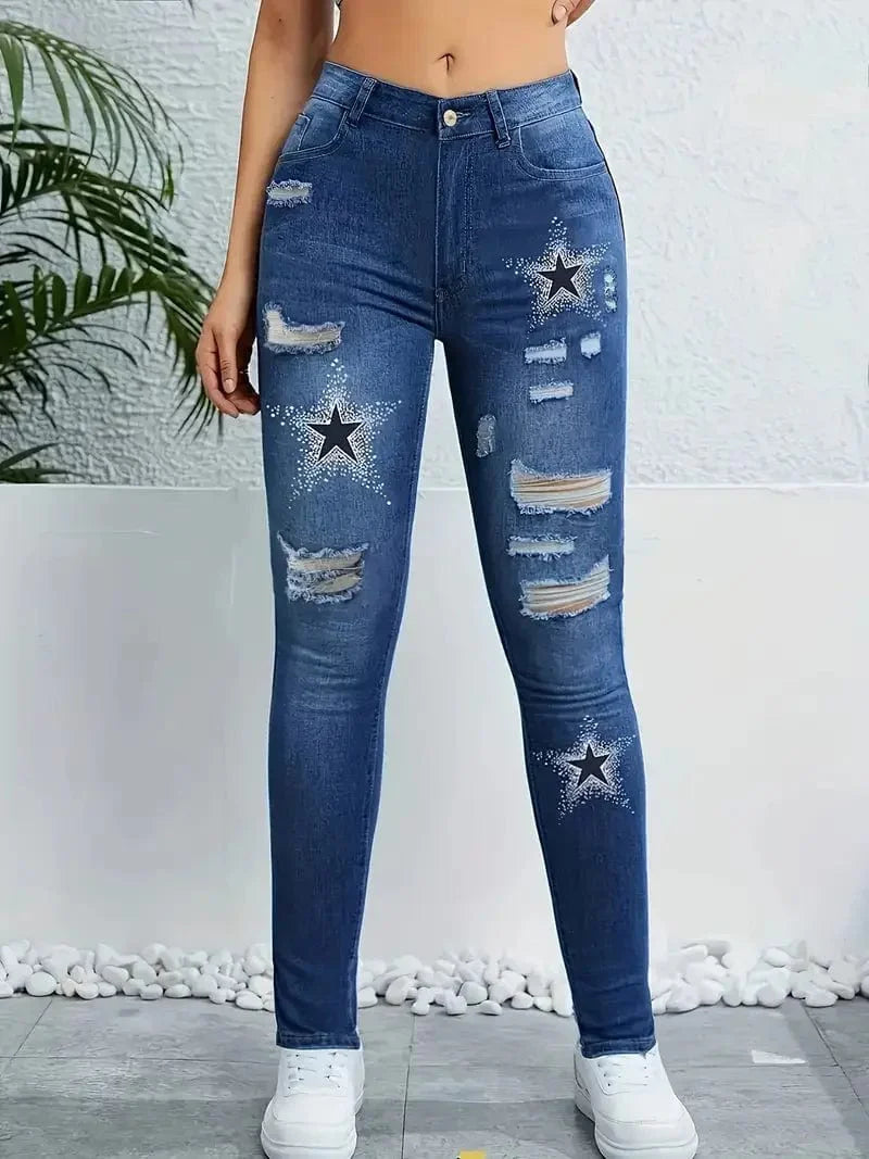 SHOWLU Women's high-waisted skinny denim jeans with star print, ripped details, and washed finish for a trendy, stylish look.