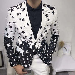 A man wears a slim-fit blazer featuring a black and white star print with a gradient design.