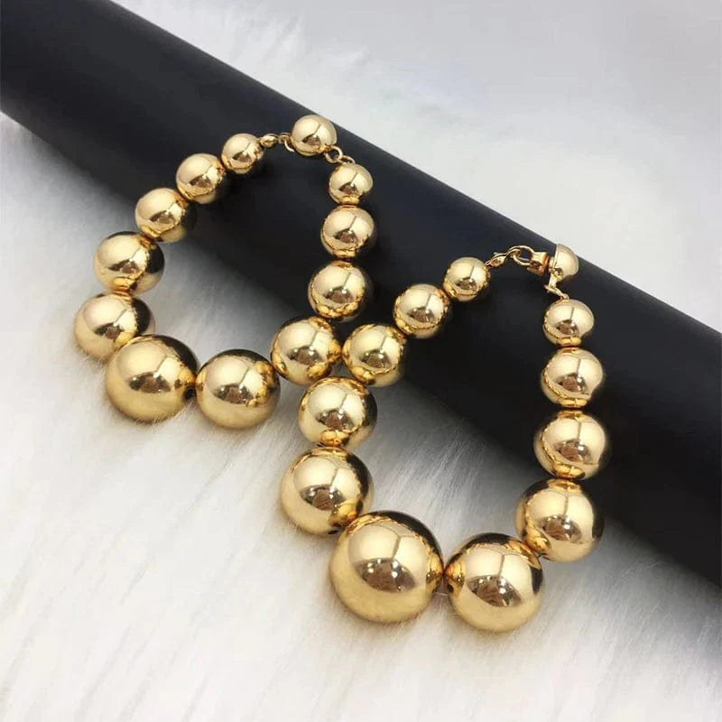 Gold ball beads chain necklace with steampunk gothic style, featuring a charm design for men and women, trendy jewelry accessory.