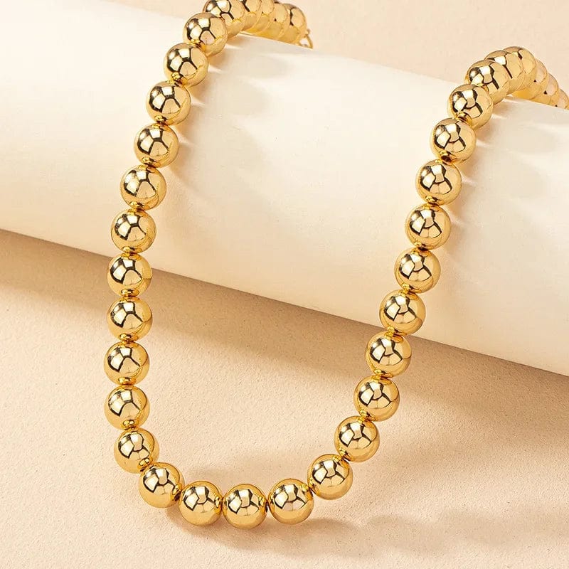 Showlu Gold Ball Beads Chain Necklace featuring a steampunk gothic design, worn as a choker for women and men.