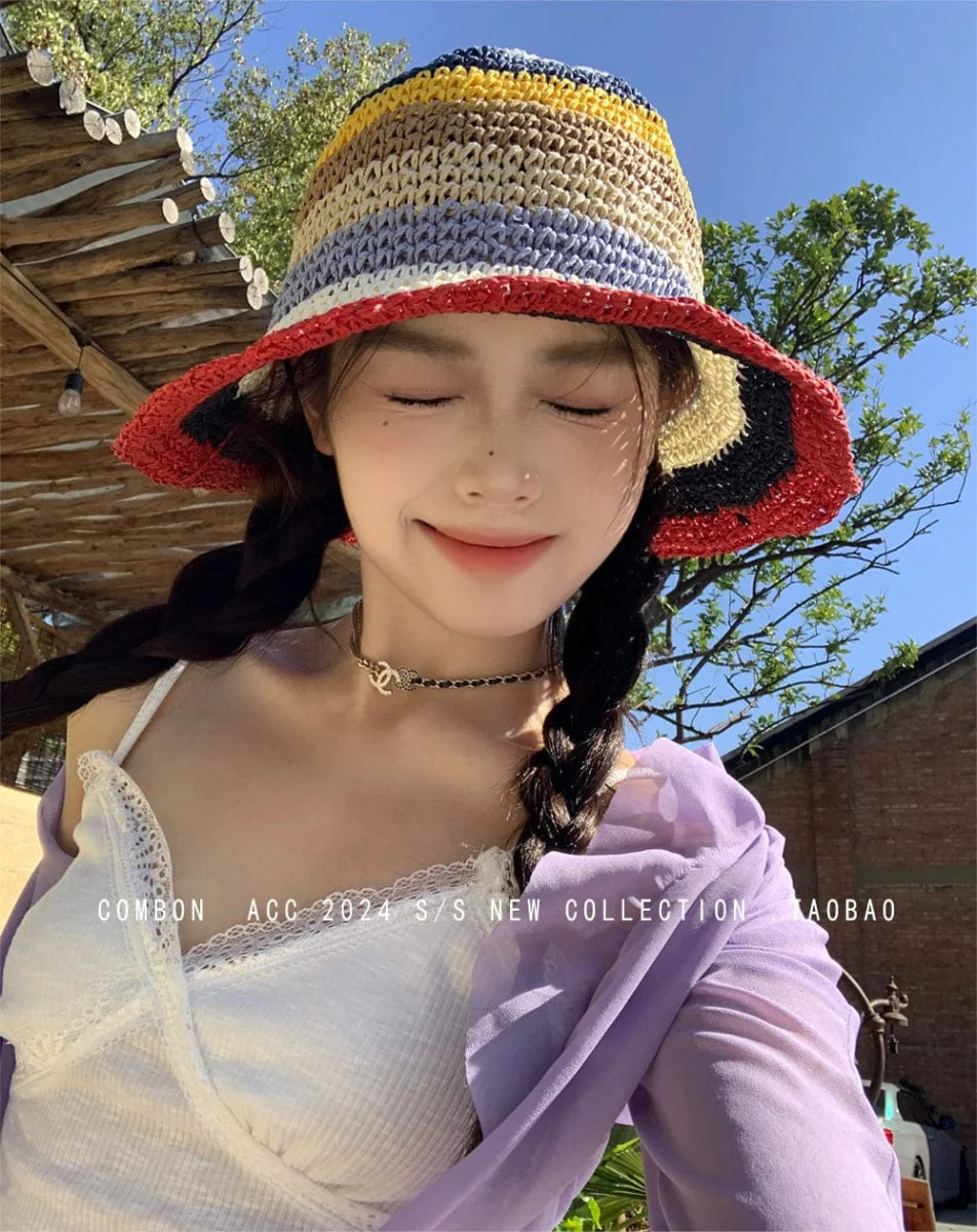 Women's rainbow straw sun hat with wide brim, stylish beach fedora for summer sun protection and fashion.