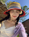 Women's rainbow straw sun hat with wide brim, stylish beach fedora for summer sun protection and fashion.