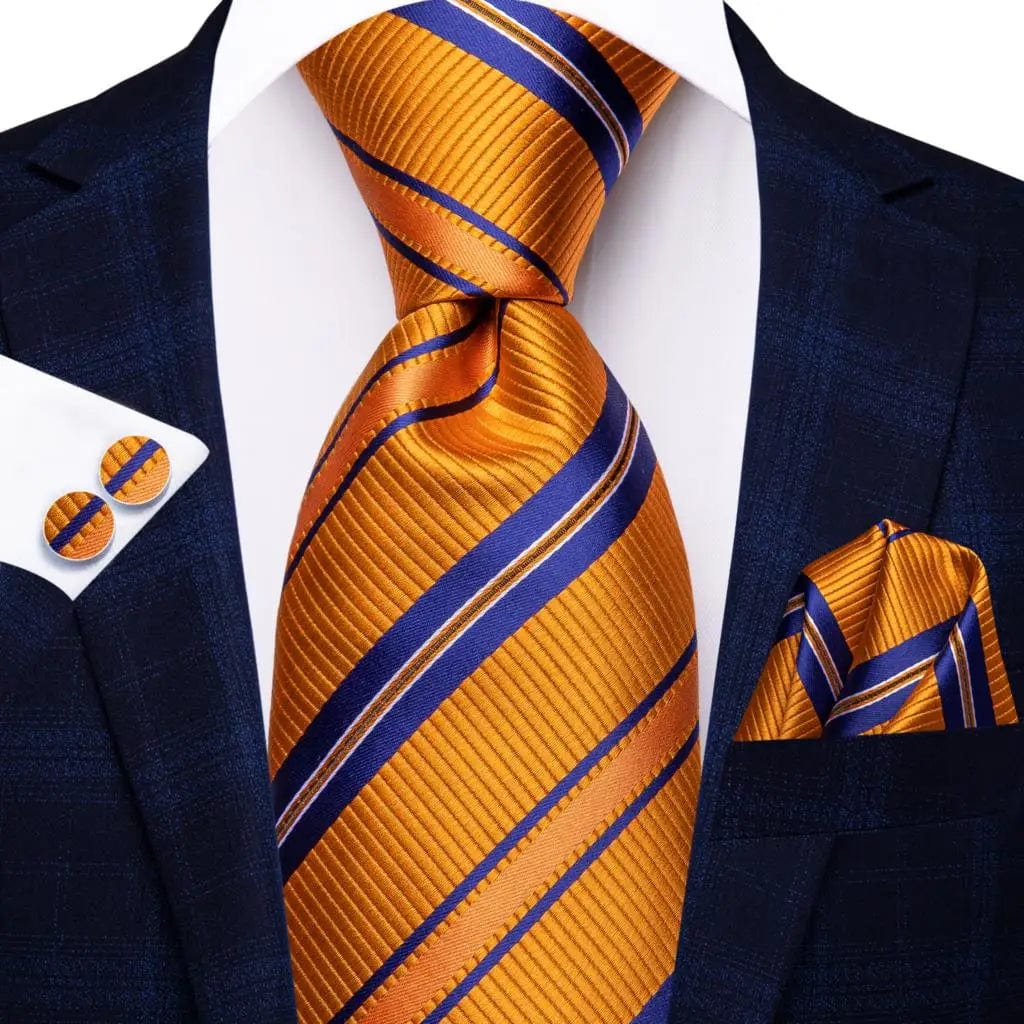 Elegant orange silk necktie set with striped pattern, matching pocket square and cufflinks for men's formal wear.