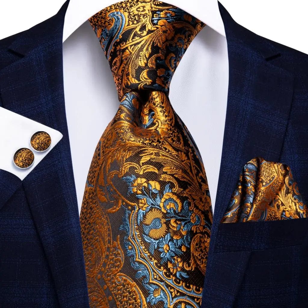 Orange silk necktie set with matching pocket square and cufflinks, featuring bold stripes for men's formal or wedding attire.