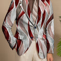 Stylish SHOWLU men's slim fit blazer with abstract print, lightweight polyester-elastane fabric, lapel collar, and button-up front.