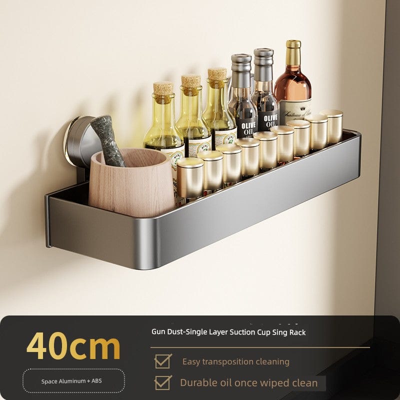 SHOWLU Space Aluminum Suction Cup Wall Condiment Hook Rack Organizer mounted on a kitchen wall, featuring multiple hooks for utensils.