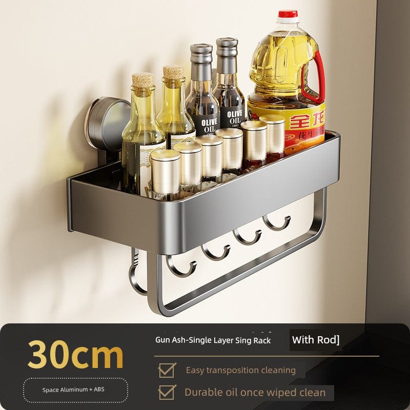 SHOWLU Space Aluminum Suction Cup Wall Condiment Hook Rack Organizer hanging on a kitchen wall with multiple hooks for utensils.