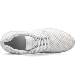 A top-down view of a white, breathable mesh casual sneaker with white laces.