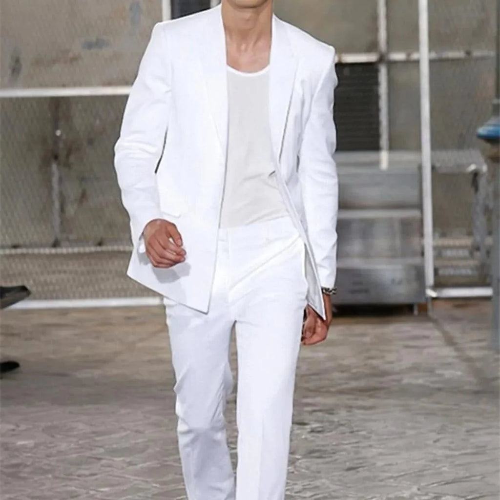 White men's wedding suit with blazer and trousers, skinny fit tuxedo for groom, featuring peaked lapels, stylish and formal.