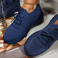 Showlu Women's Mesh Breathable Platform Sneakers with casual lace-up design and vulcanized sole, ideal for summer and sports.