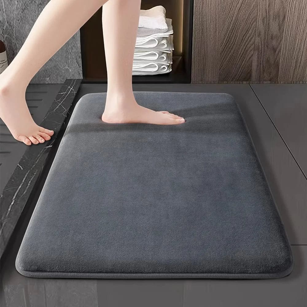 Super absorbent coral velvet bath mat by Showlu Fashion, anti-slip bathroom floor mat with plush texture and non-slip backing.