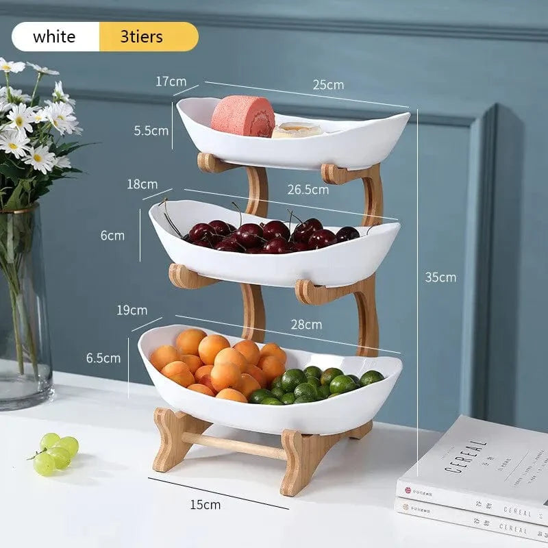 Showlu Wooden Style Oval Fruit Plates with partitions for serving fruit, candy, and cake on a wooden dinnerware tray.